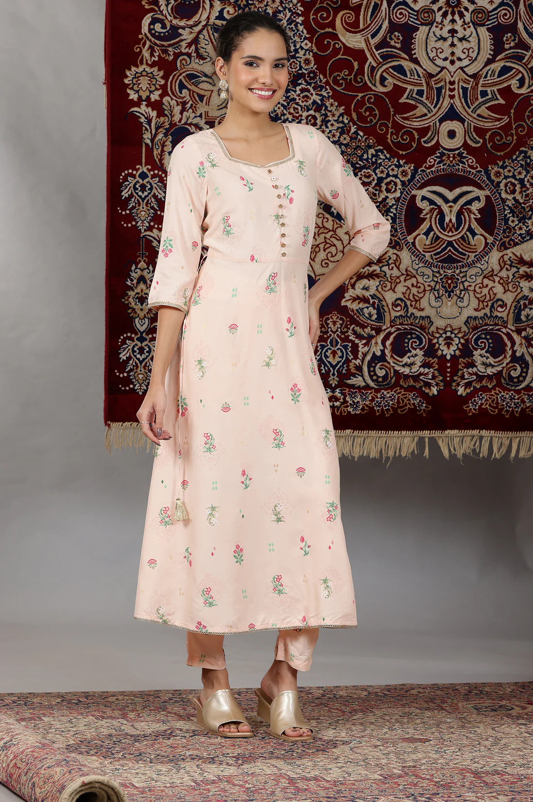 Elegant Light Peach Flared Kurta Set with Floral Prints and Lace Detailing, Coordinated Pants, and Matching Dupatta