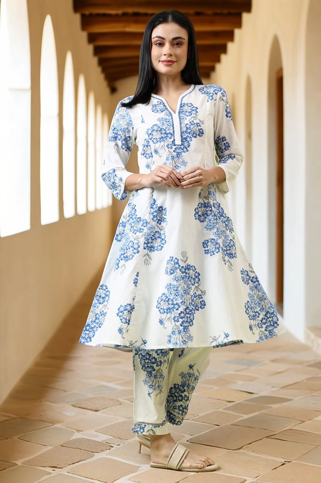 Comfortable Women’s White Cotton Kurta and Pants Set with Flared Design and Floral Print for Casual and Festive Occasions