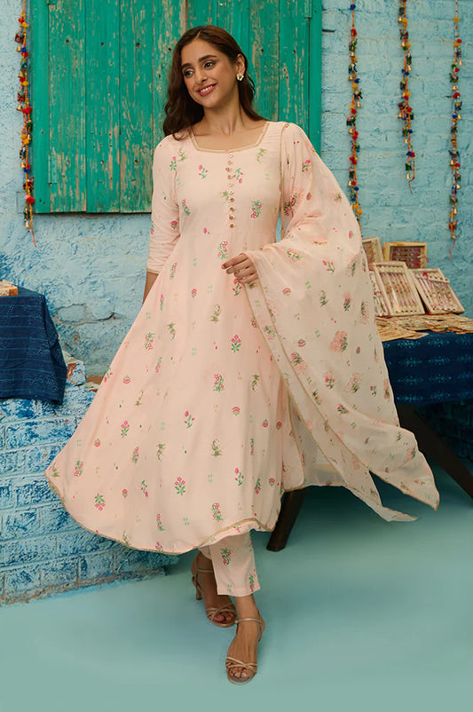 Elegant Light Peach Flared Kurta Set with Floral Prints and Lace Detailing, Coordinated Pants, and Matching Dupatta