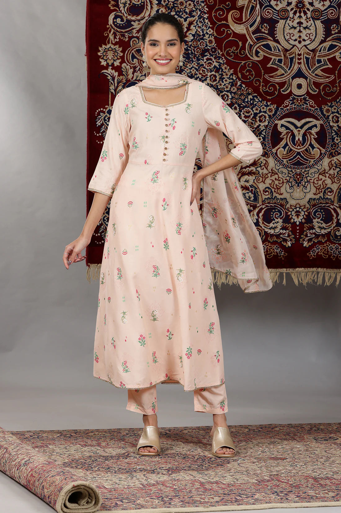 Elegant Light Peach Flared Kurta Set with Floral Prints and Lace Detailing, Coordinated Pants, and Matching Dupatta