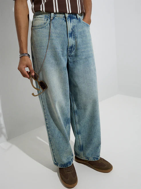 Trendy Mid-Rise Light Blue Barrel-Fit Jeans with Washed Detailing for Modern Casual Outfits