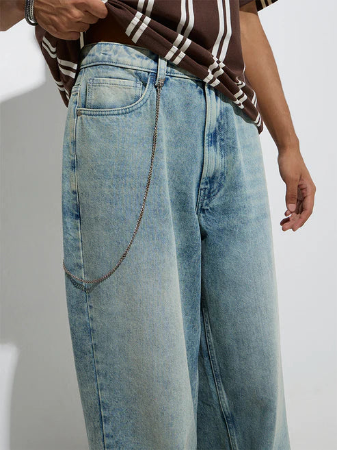 Trendy Mid-Rise Light Blue Barrel-Fit Jeans with Washed Detailing for Modern Casual Outfits