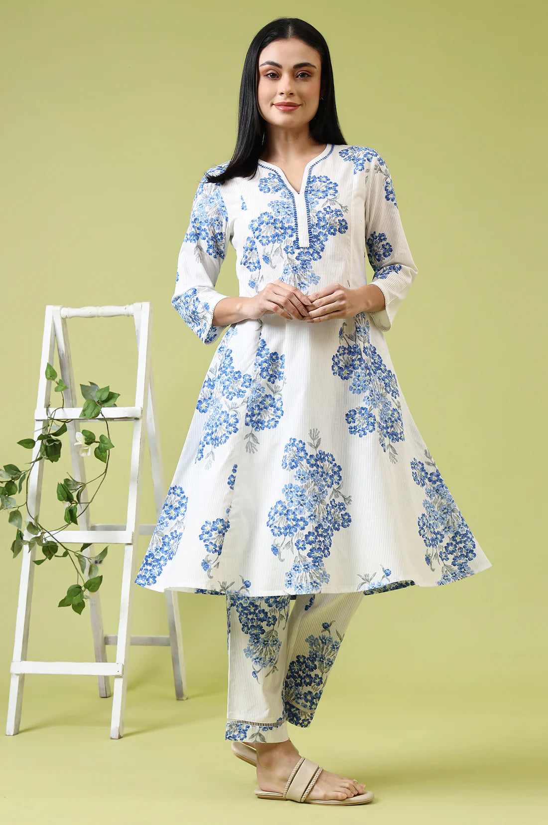 Comfortable Women’s White Cotton Kurta and Pants Set with Flared Design and Floral Print for Casual and Festive Occasions